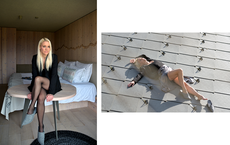 hotel bohinj Slike druga ob drugi: Levo: ženska z dolgimi svetlimi lasmi sedi na mizi v sobi, obloženi z lesom, oblečena v črno jopico, črne prosojne nogavice in sive čevlje. Desno leži v podobni obleki na sivih ploščicah na prostem.